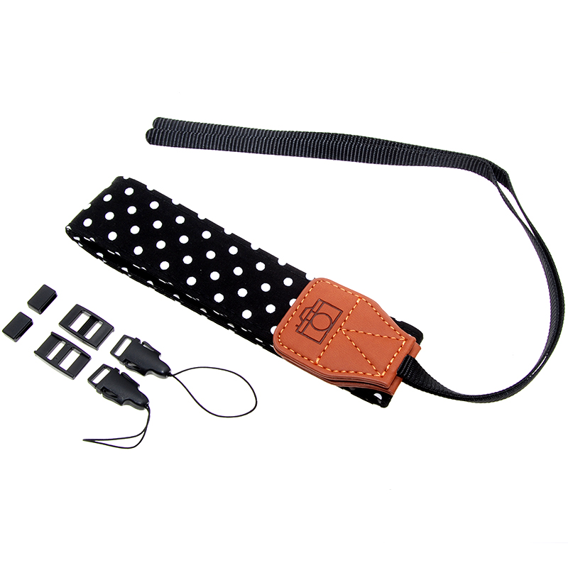 Tracolla universale per fotocamere reflex, nera con pois bianchi. Sgancio rapido